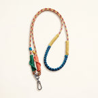 Braided rope phone lanyard and bag strap in Carnival (rainbow & teal), metal swivel and spring clips.