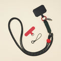 Braided rope phone lanyard in Onyx (black & red), knot-work detail, phone tabs and mini loop.