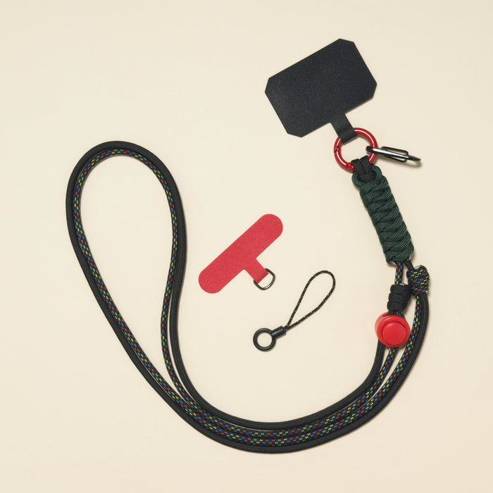Braided rope phone lanyard in Onyx (black & red), knot-work detail, phone tabs and mini loop.