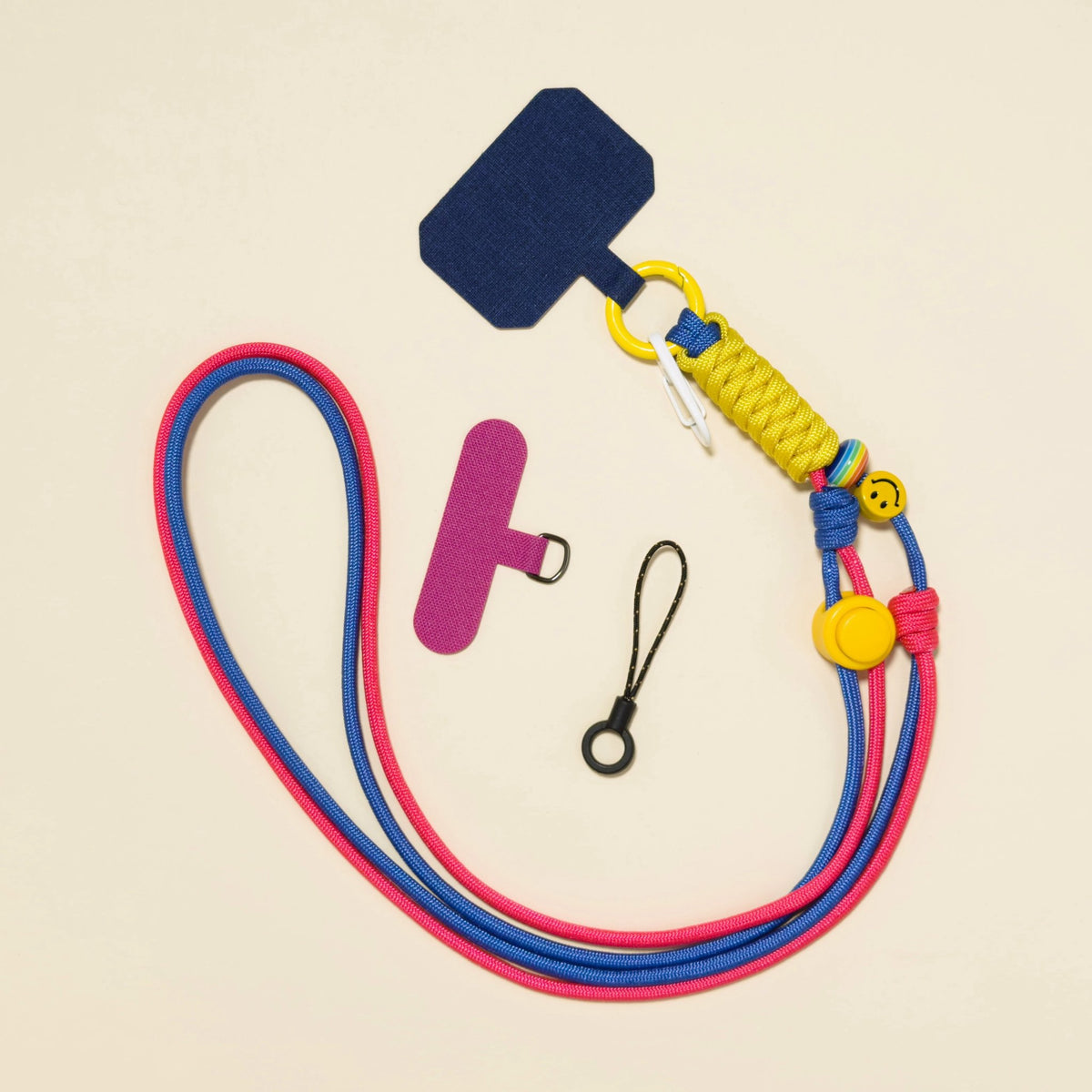 Braided rope phone lanyard in Bloom (pink & blue), with beads, phone tabs and mini loop.